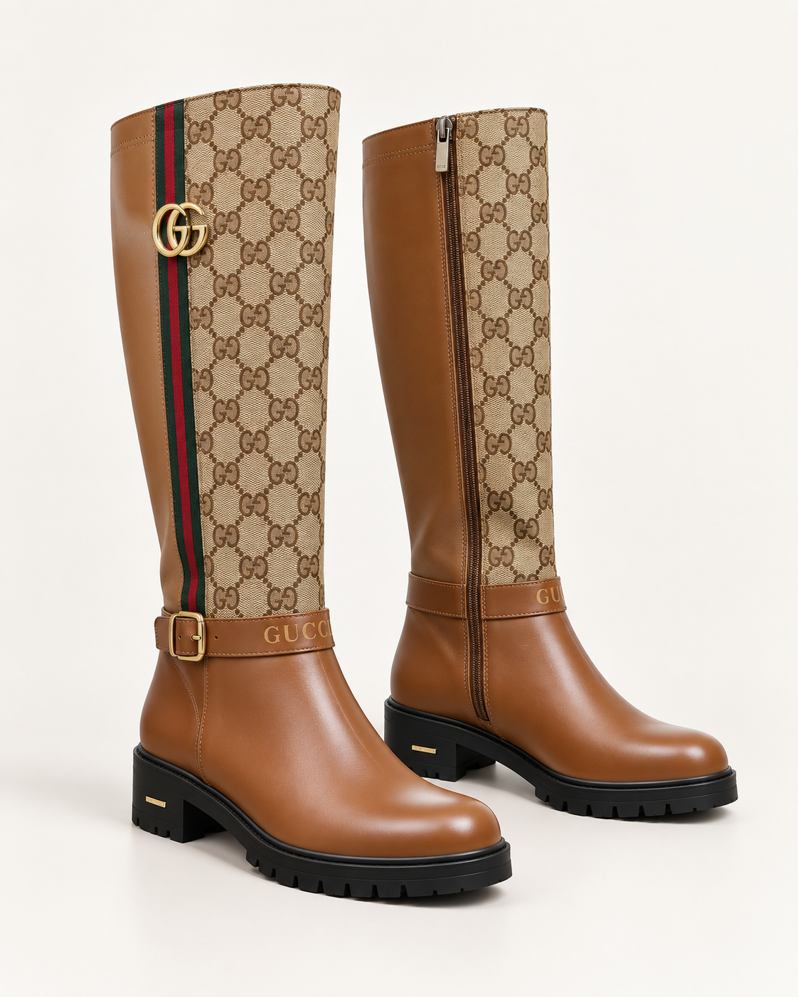 A pair of Gucci knee-high boots featuring tan leather and beige GG monogram canvas, with a signature green and red web stripe and gold-tone hardware.